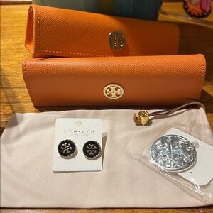 Tory Burch eye glass cases and fashion earrings.